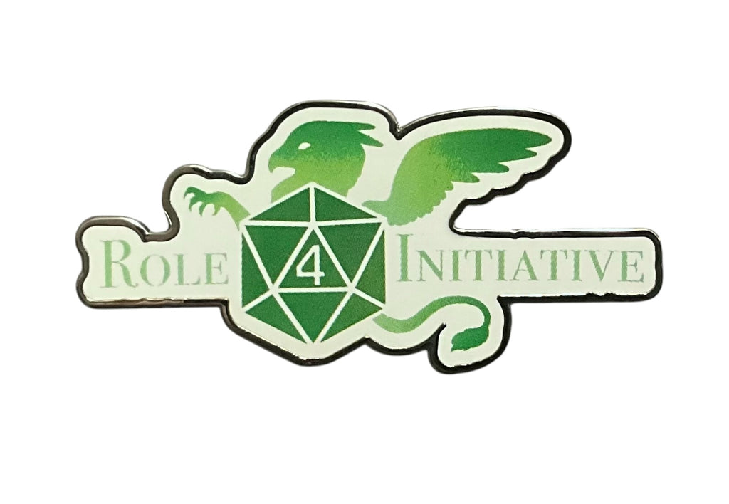 A soft enamel pin depicting the Role 4 Initiative Logo