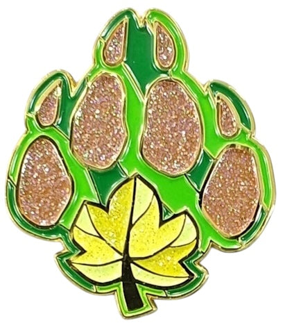 A 1.5-inch enamel pin with a green and brown color scheme, featuring a glittering design that represents the Druid character class.
