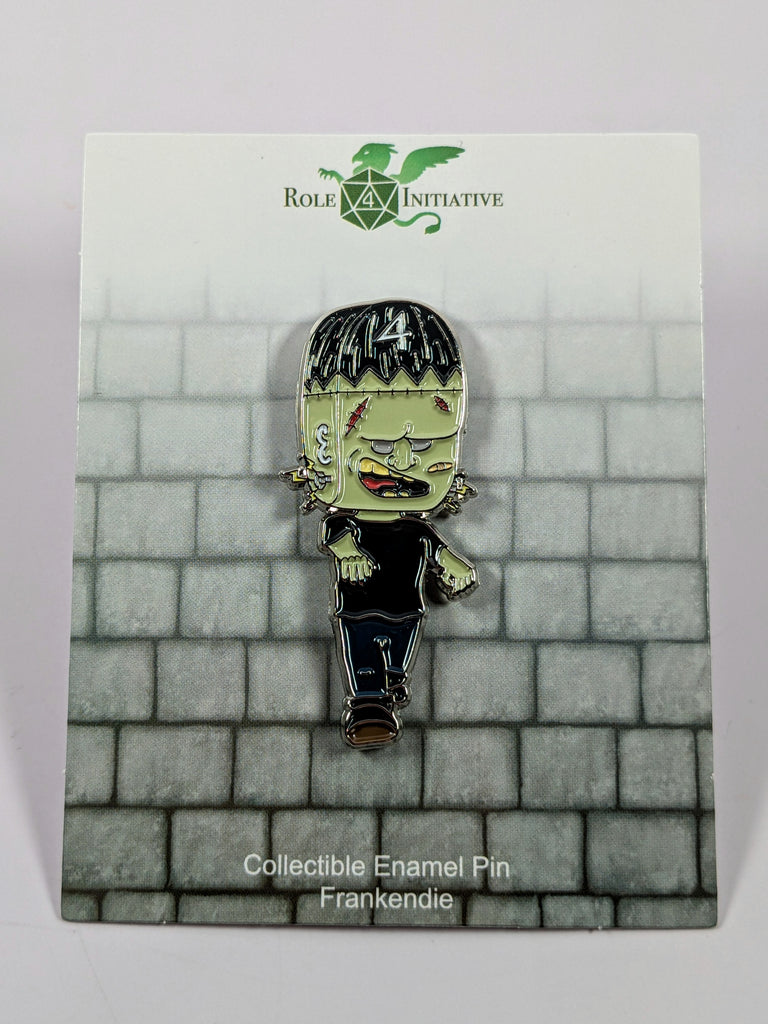 A collectible enamel pin featuring a stylized, cartoonish character with a black top and blue jeans, with a '4' on the top left, and a green face with black hair.