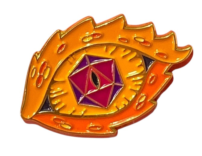 An enamel pin shaped like a fiery orange eye of a dragon with a violet iris and a number 1-shaped pupil.