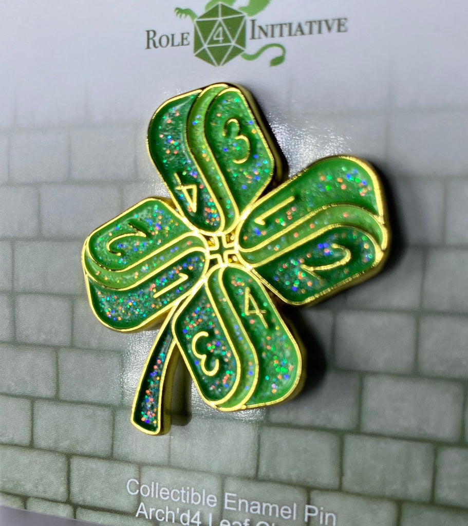 Hard enamel pin to depict a lucky 4-leaf clover made up of Arch'd4s, packaged in a polybag with backing card containing description, SKU, and UPC barcode.