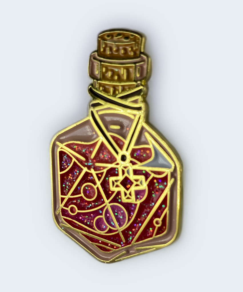 Hard enamel pin depicts a d20-shaped health potion bottle in bubbling red and pink hues, with a healing red cross gem draped around the bottle's neck.