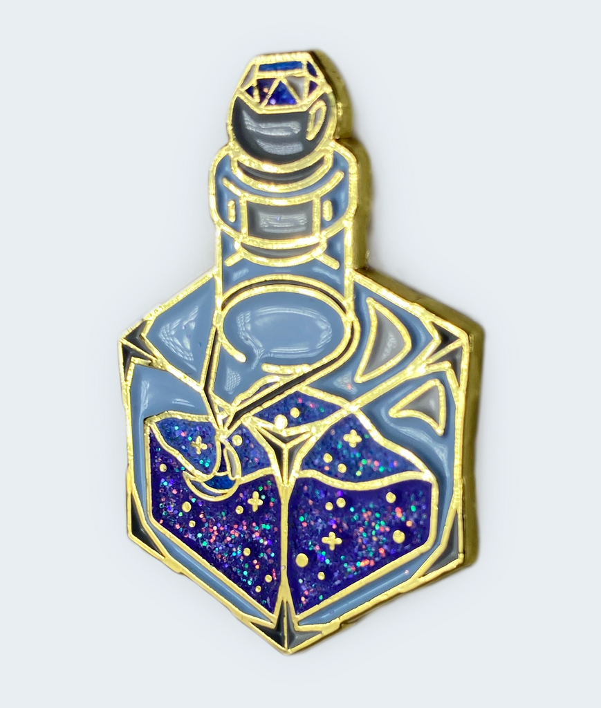 This 1.5"-tall glittering enamel pin depicts a d6-shaped magic dust bottle in crushed blue and indigo hues, with a moon shaped gem pendant hung around the bottle's neck. The vibrant colors are dressed in iridescent glitter in the dust contents, the moon pendant, and the gem encrusted in the stopper.