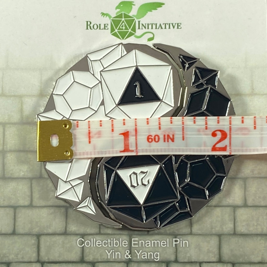 Collectible enamel pin with dice design and measurement tool, featuring 'Role Initiative' logo.